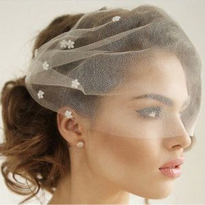 New, White birdcage veil with floral detail. Wedding white veil